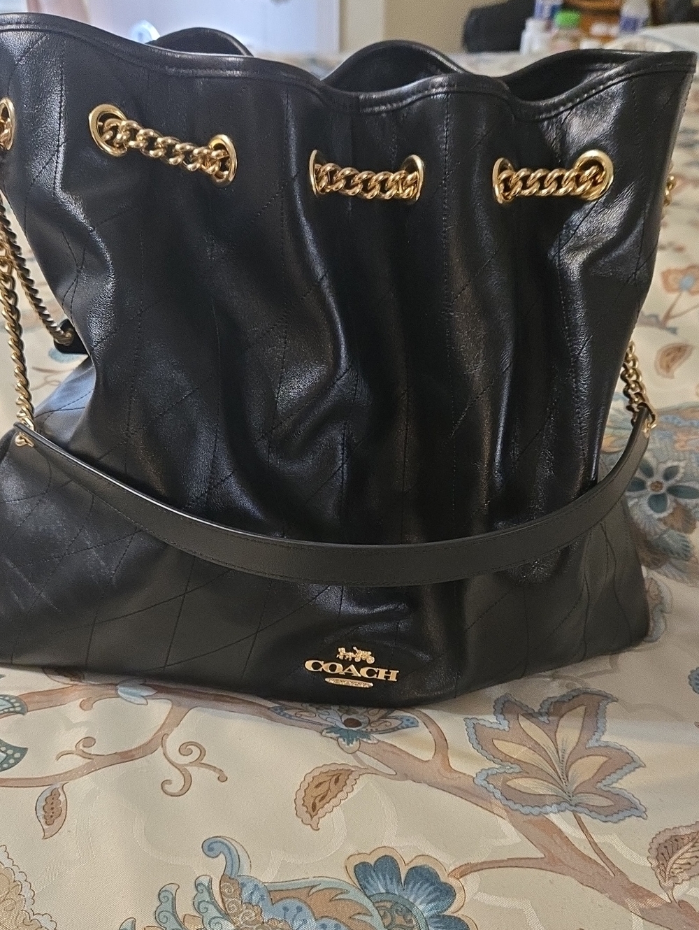 Coach Black Quilted Leather Drawstring Shoulder Bag with Gold Chain Accents
